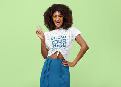T-Shirt Mockup of a Stylish Woman With Afro Hair Posing With a Peace Sign