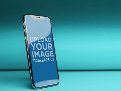 Angled iPhone X Mockup in a Solid Color Room a20083