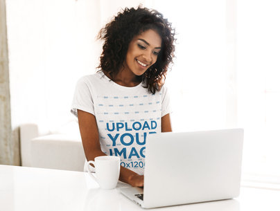 Heathered T-Shirt Mockup Featuring a Woman With Afro Hair Using a Laptop