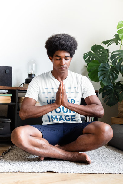 V-Neck T-Shirt Mockup Featuring a Man With Afro Hair Practicing Yoga