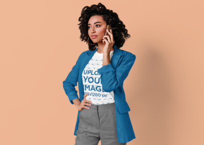 T-Shirt Mockup Featuring a Serious Woman Posing and Talking on the Phone