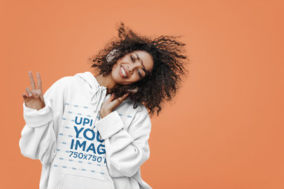 Hoodie Mockup of a Woman with Curly Hair Making a Peace Hand Sign m29782 r-el2