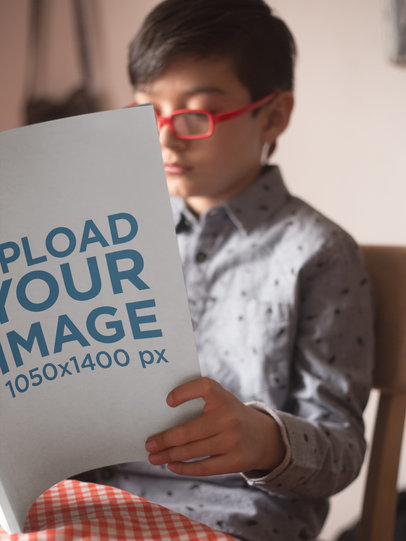 Book Mockup Being Read by a Boy on his Table