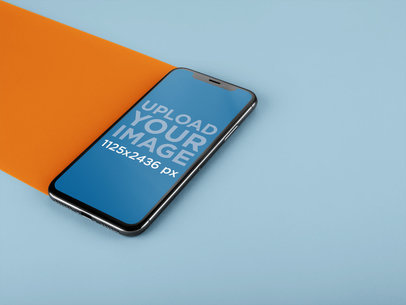 iPhone X Mockup Lying on a Double Colored Surface a20086