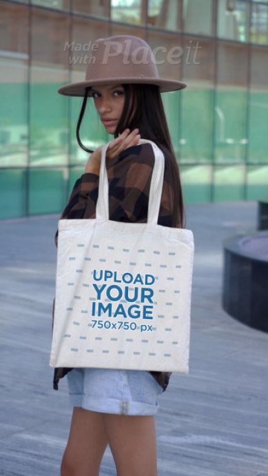 Video of a Posing by the Street While Holding a Tote Bag