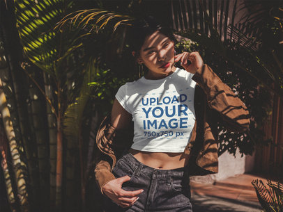 Beautiful Woman Wearing a Crop Top T-Shirt Mockup Under Palms