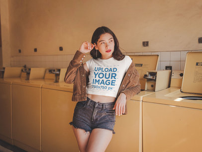 Girl Wearing a Crop Top Tee Mockup Leaning Against a Washing Machine a19296