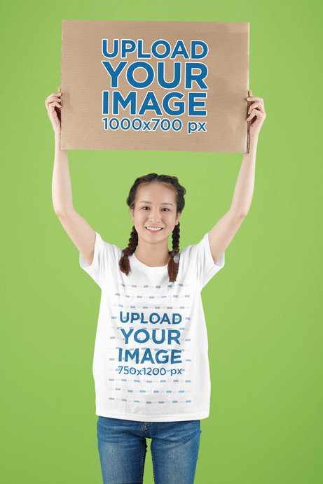Round-Neck Tee Mockup of a Woman with Braids Holding a Customizable Cardboard Sign