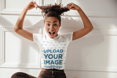 T-Shirt Mockup Featuring a Woman with a Surprise Expression Holding Her Hair