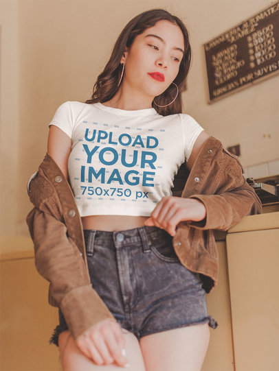 Woman Wearing a Crop Top Tee Mockup at the Laundry