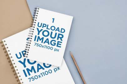 Mockup of Two Spiral Notebooks Placed by a Pencil