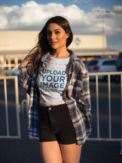 Gorgeous Woman Wearing a Crop Top Tee Mockup Outside a Parking Lot