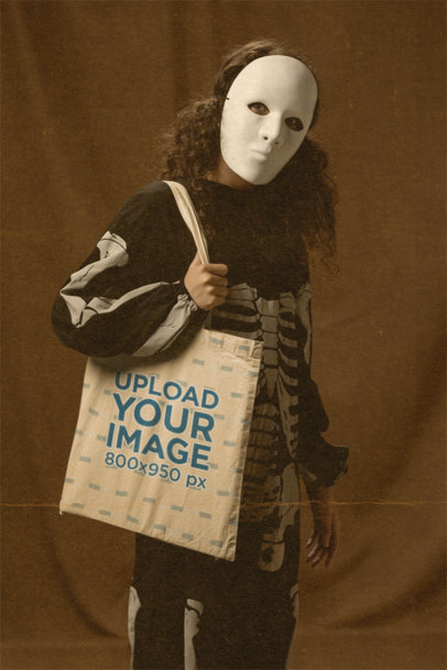 Sepia Mockup of a Kid Holding a Halloween Tote Bag 