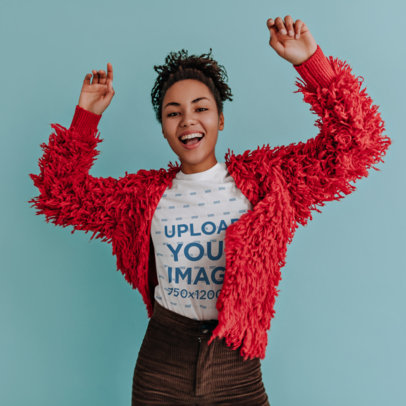 Crewneck T-Shirt Mockup of a Happy Woman Lifting Her Arms