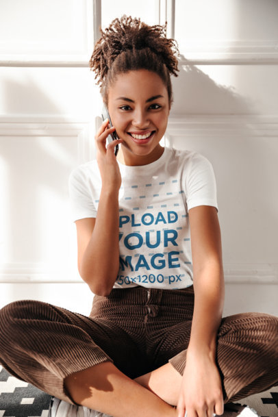 Round-Neck Tee Mockup of a Woman Talking on Her Mobile Phone