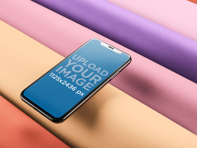 iPhone X Mockup Floating Over a Multicolor Smooth Surface a20089