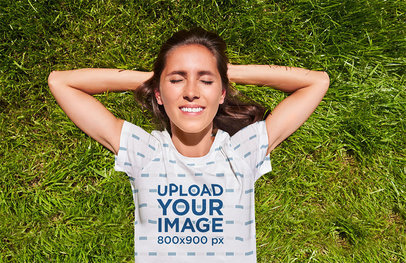 Round-Neck T-Shirt Mockup Featuring a Woman Resting on the Grass m26485 r-el2
