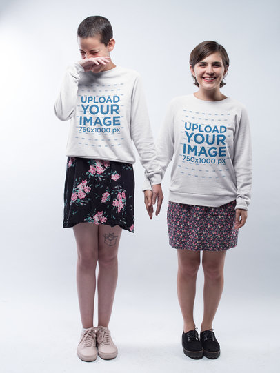 Mockup of an LGBT Couple Laughing Wearing Crewneck Sweatshirts in a White Room a20000