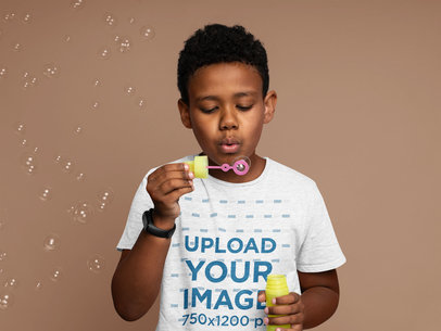 Heathered Tee Mockup Featuring a Kid Blowing Bubbles