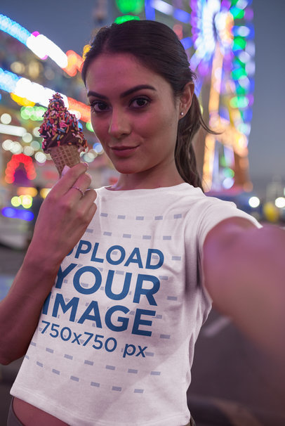 Selfie of a Woman Wearing a T-Shirt Mockup Showing an Ice Cream