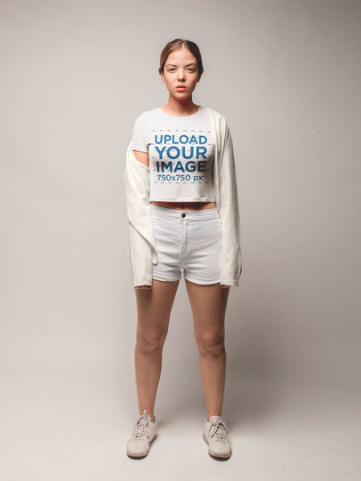 Woman Wearing a Crop Top Tshirt Template Standing in a White Room