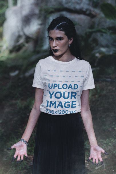Bella Canvas Tee Mockup Featuring a Woman With a Wicca-Themed Outfit in a Forest