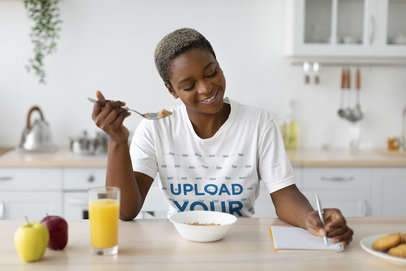 Crewneck Tee Mockup of a Woman Having Breakfast and Taking Notes m25715 r-el2