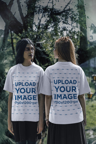 T-Shirt Mockup Featuring Two Women Wearing Dark Forest-Inspired Outfits