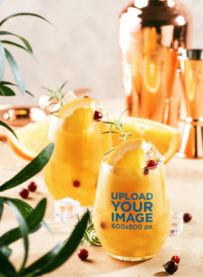 Xmas Summer Mockup Featuring a Wine Glass Filled With an Orange Cocktail