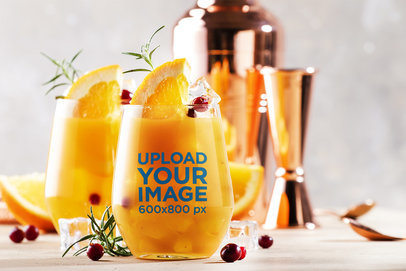 Xmas Summer Mockup of a Stemless Wine Glass Filled With an Orange Drink