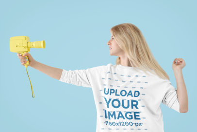 Sweatshirt Mockup Featuring a Woman Using a Retro Camera in a Studio m22733 r-el2