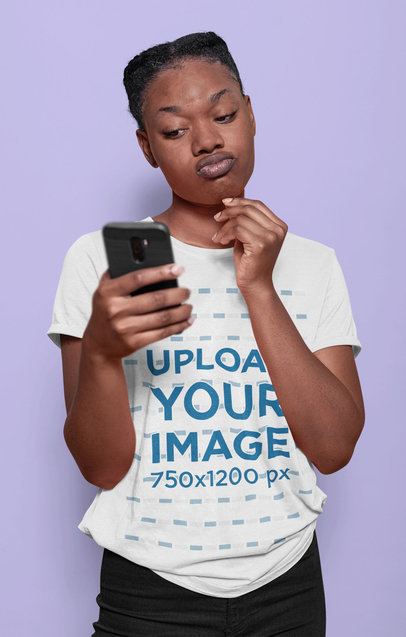 Round-Neck Tee Mockup of a Woman Checking Her Smartphone