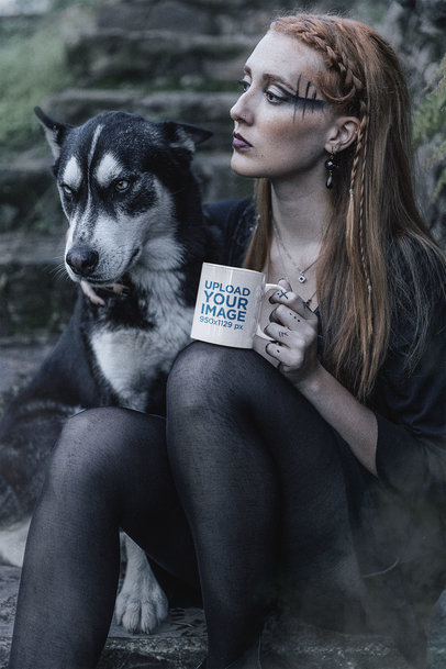 Mockup of a Mug Featuring a Tattooed Woman Posing With a Dog in the Forest