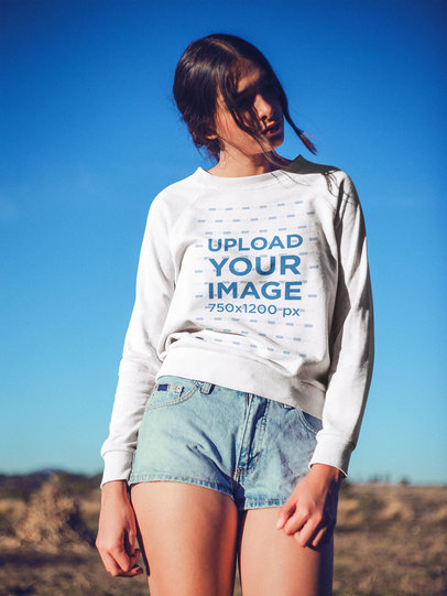 Portrait of a Woman Wearing a Crewneck Sweater Mockup Outdoors
