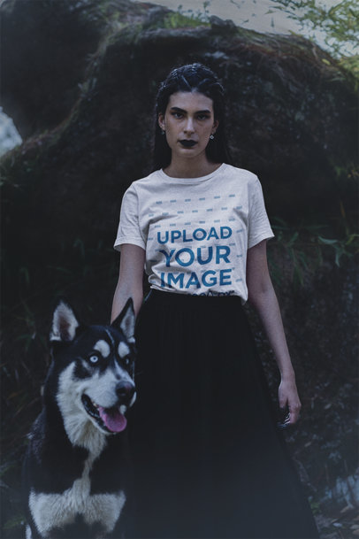 Bella Canvas T-Shirt Mockup of a Woman Posing with Her Husky in a Forest