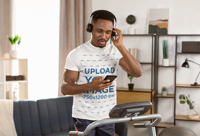 Round-Neck Tee Mockup of a Man Exercising on a Treadmill at Home