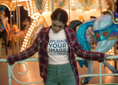 Bored Woman Wearing a Crop Top Tee Mockup Against a Carousel