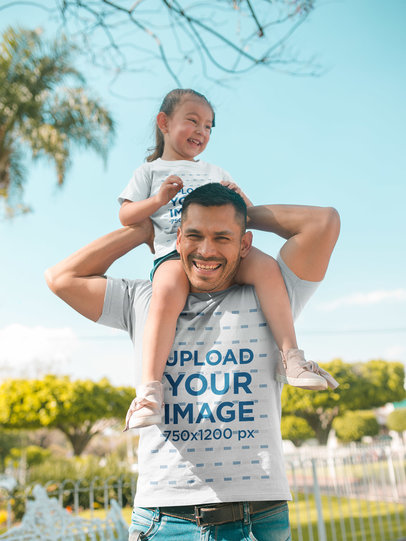 Family T-Shirt Mockup of a Dad with his Daughter Wearing Tshirts Outdoors