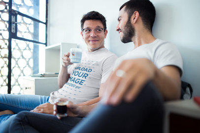 Gay T-Shirts Mockup Featuring a Couple Having a Coffee Before Work