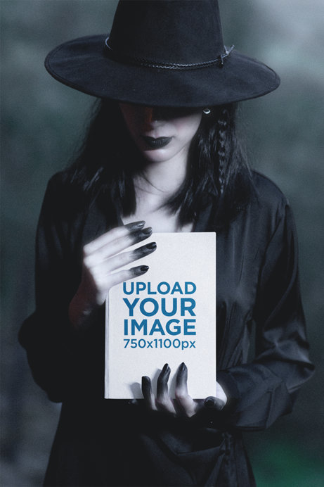Mockup of a Woman in a Witch-Inspired Costume Holding a Hard Cover Book