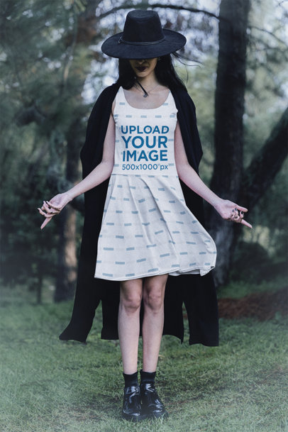 Mockup of a Woman Posing in the Woods with a Skater Dress and a Cape m29729