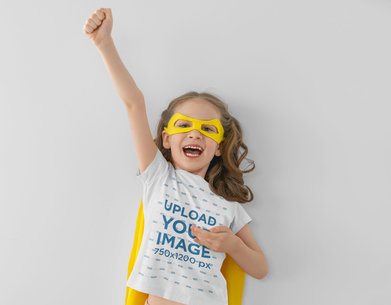 Round-Neck T-Shirt Mockup of a Happy Girl with a Superhero Outfit