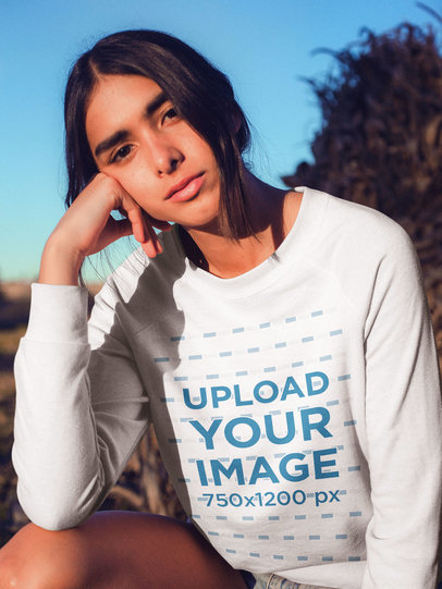 Closeup of a Pretty Woman Wearing a Crewneck Sweater Mockup Outdoors