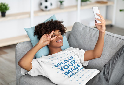 Round-Neck Tee Mockup Featuring a Teenage Boy with Afro Hair Taking a Selfie