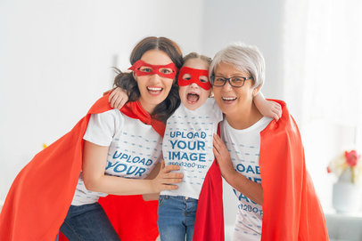 T-Shirt Mockup of a Woman Wearing Superhero Costumes with Her Mom and Daughter