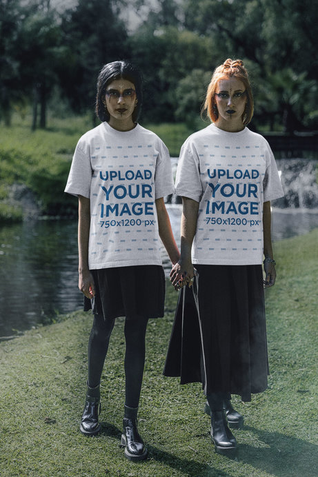 Round-Neck Tee Mockup of Two Women Holding Hands in a Wicca-Themed Setting