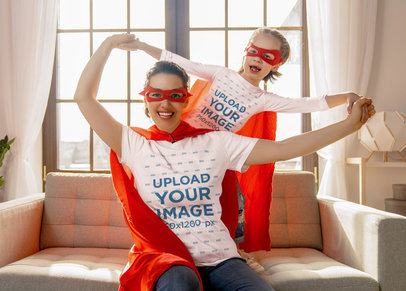 T-Shirt Mockup Featuring a Woman and Her Daughter Wearing Superhero Outfits
