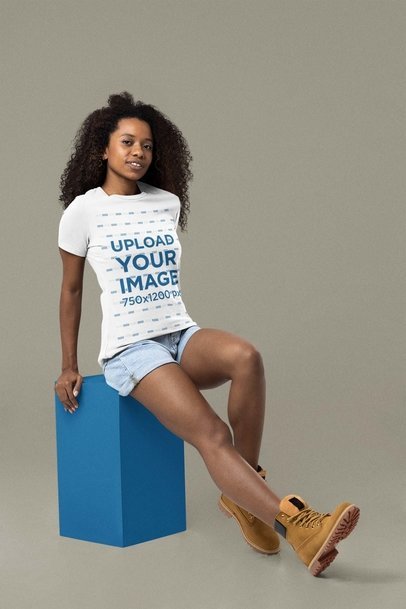 Mockup of a Woman with Curly Hair Wearing a Bella Canvas T-Shirt 