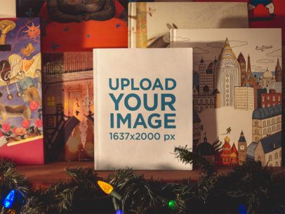 Book Mockup Standing on a Shelf Near Christmas Lights