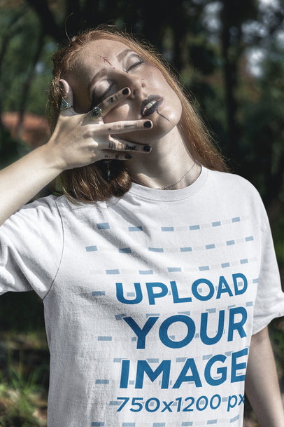 T-Shirt Mockup of a Woman With Her Eyes Closed Posing in a Forest